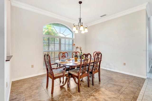 tiled dining space featuring crown molding and an inviting chandelier