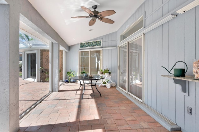 sunroom / solarium featuring ceiling fan and lofted ceiling