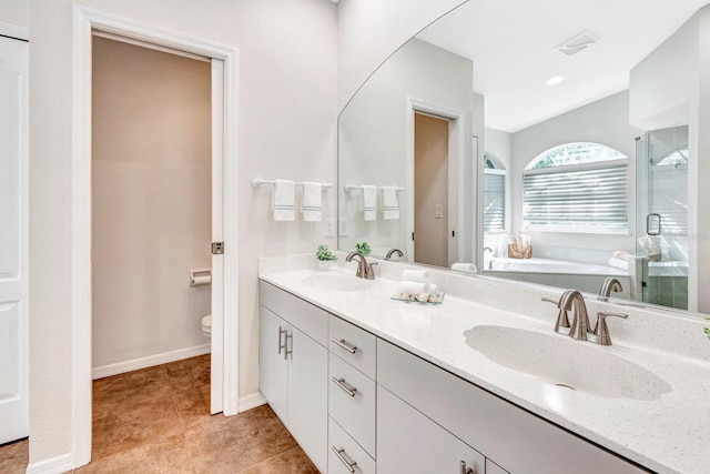 full bathroom featuring separate shower and tub, toilet, and vanity