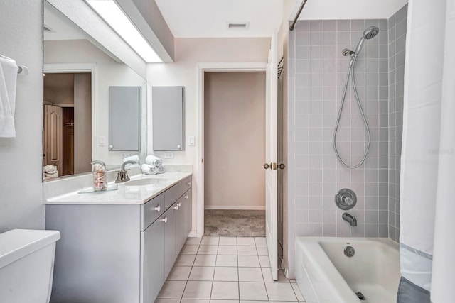 full bathroom featuring toilet, tile patterned floors, shower / bathtub combination with curtain, and vanity