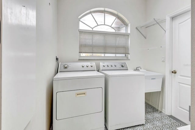 washroom with washer and dryer