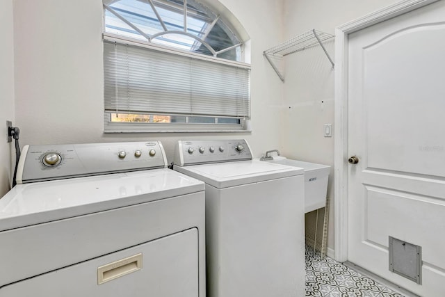 laundry area with washing machine and dryer