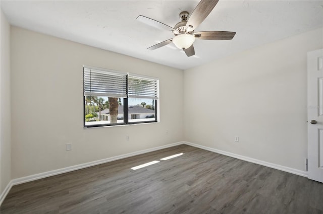 unfurnished room with ceiling fan and dark hardwood / wood-style floors