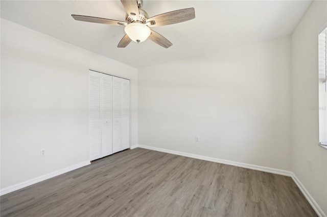 unfurnished room featuring hardwood / wood-style flooring and ceiling fan