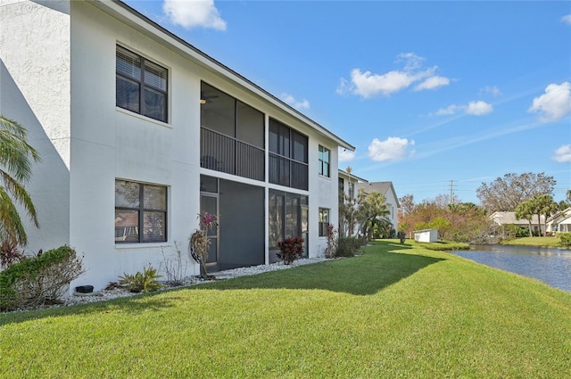 view of side of property featuring a yard