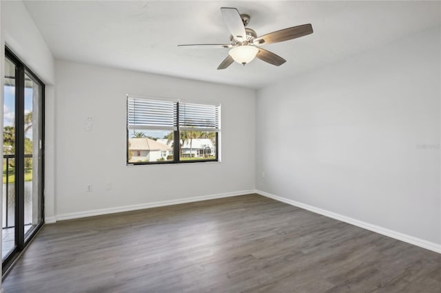 unfurnished room with dark hardwood / wood-style floors and ceiling fan