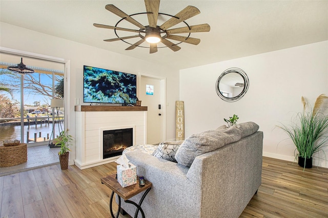 living room with hardwood / wood-style floors and ceiling fan