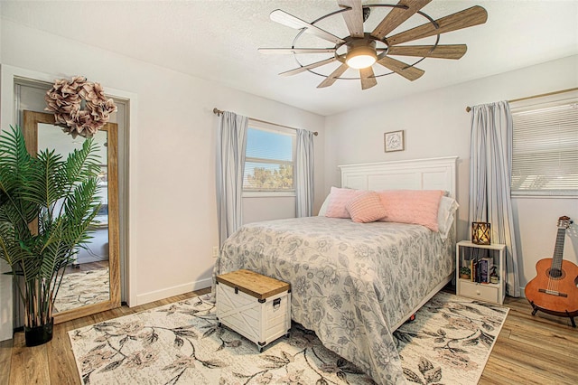 bedroom featuring light hardwood / wood-style floors and ceiling fan