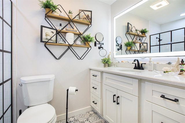 bathroom featuring vanity, toilet, tile patterned flooring, and a shower with door