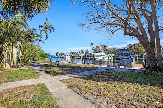 exterior space featuring a dock and a water view