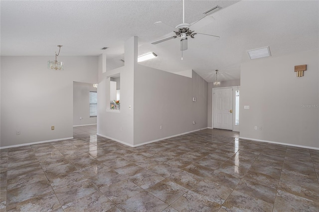 unfurnished living room featuring high vaulted ceiling, a textured ceiling, and ceiling fan with notable chandelier