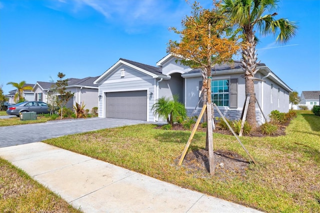 ranch-style house with a front yard and a garage