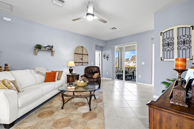 tiled living room with ceiling fan