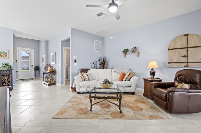 living room featuring ceiling fan and light tile patterned floors