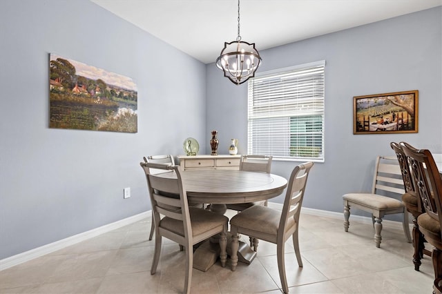 dining room featuring a notable chandelier and light tile patterned flooring