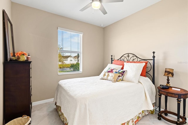 bedroom with light tile patterned floors and ceiling fan