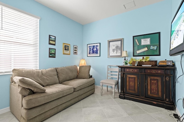 tiled living room with a wealth of natural light