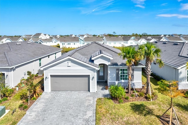 single story home featuring a garage