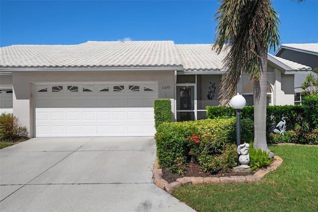 ranch-style house featuring a garage