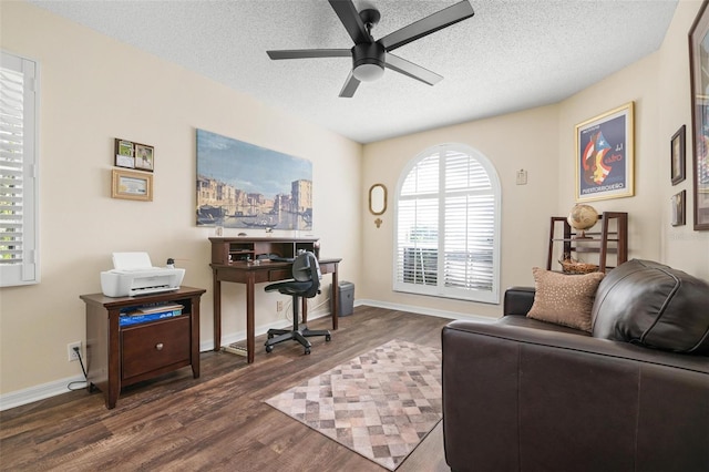 office featuring ceiling fan, a textured ceiling, and dark hardwood / wood-style flooring