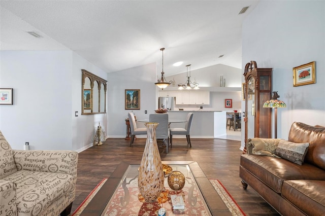 living room featuring lofted ceiling and dark hardwood / wood-style flooring