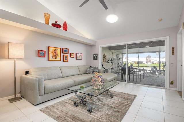 living room with lofted ceiling, ceiling fan, and light tile patterned floors