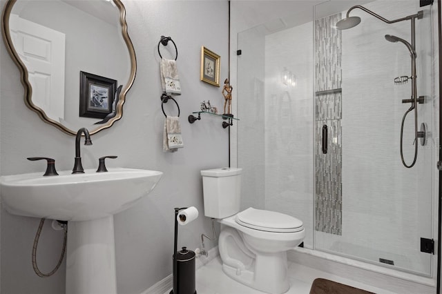 bathroom with tile patterned floors, toilet, and an enclosed shower