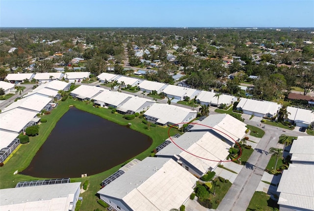 bird's eye view with a water view