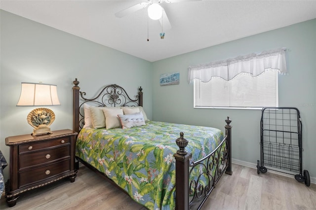 bedroom featuring light hardwood / wood-style flooring and ceiling fan