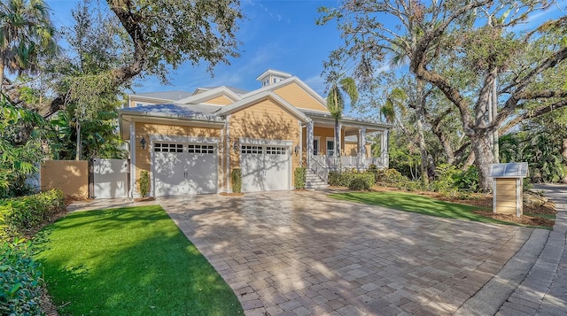 view of front of home with a front lawn and covered porch