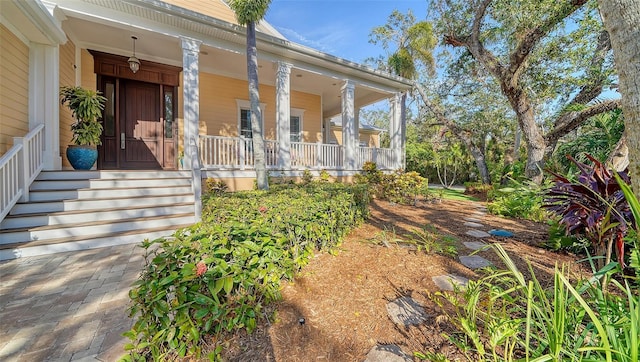 doorway to property featuring a porch