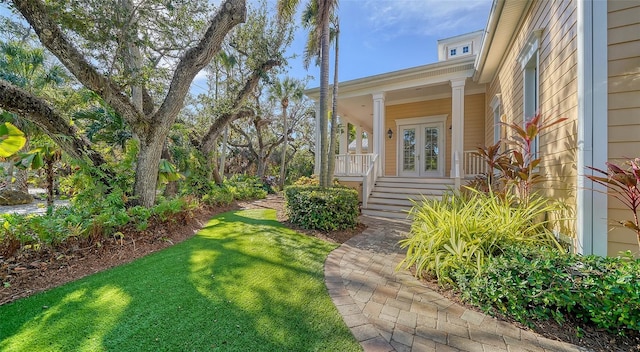 view of yard with covered porch