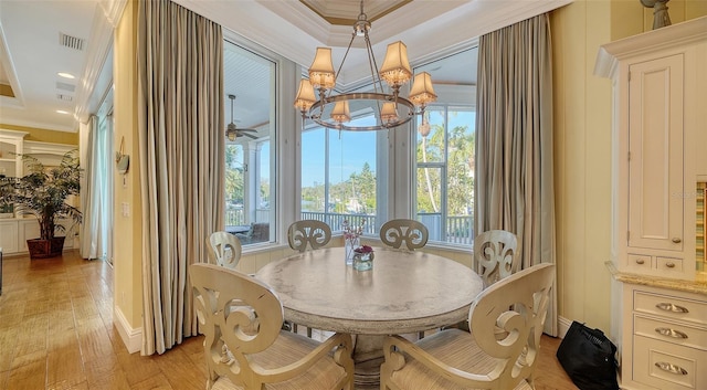 dining area with ceiling fan, ornamental molding, and light hardwood / wood-style flooring