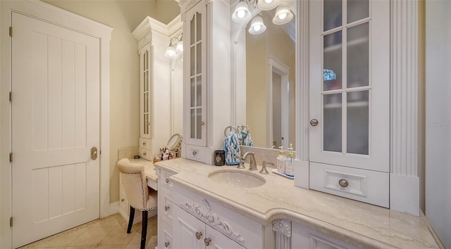 bathroom featuring tile patterned flooring and vanity