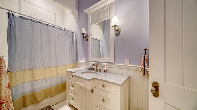 bathroom featuring vanity and shower / bathtub combination with curtain