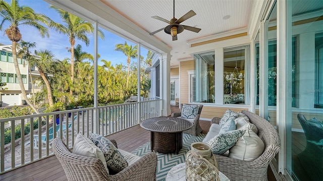 sunroom / solarium featuring ceiling fan