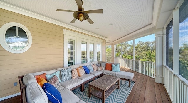 sunroom featuring ceiling fan