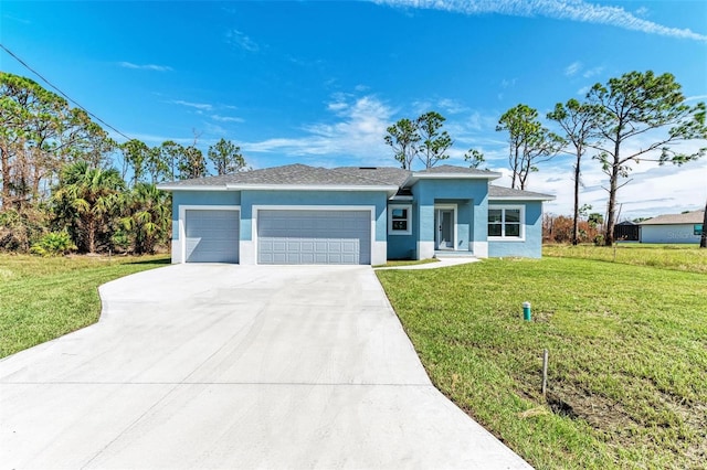 view of front of house featuring a front yard and a garage