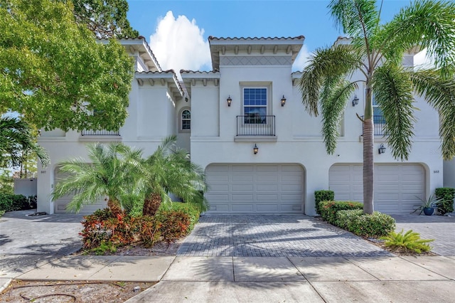 mediterranean / spanish house with a garage