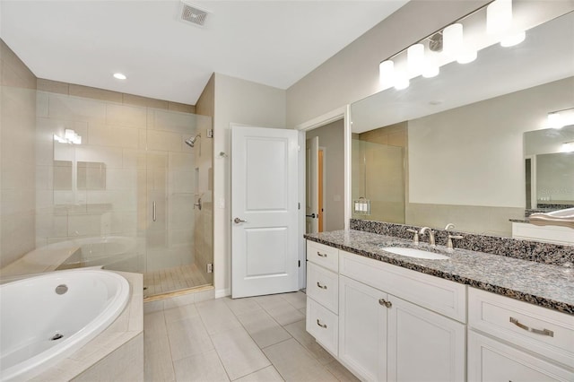 bathroom with vanity, shower with separate bathtub, and tile patterned floors