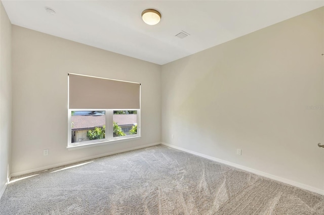 empty room with light colored carpet