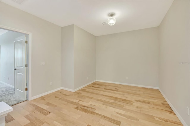 empty room with light wood-type flooring