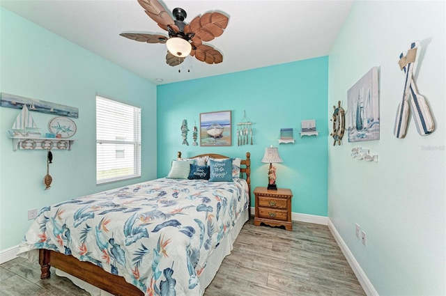 bedroom featuring ceiling fan and light wood-type flooring