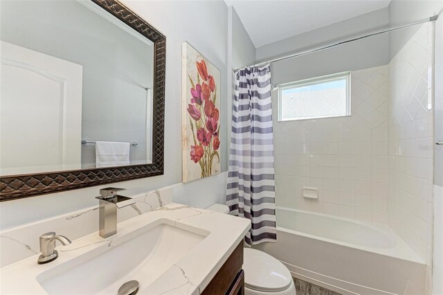 full bathroom featuring toilet, shower / bath combo, and vanity