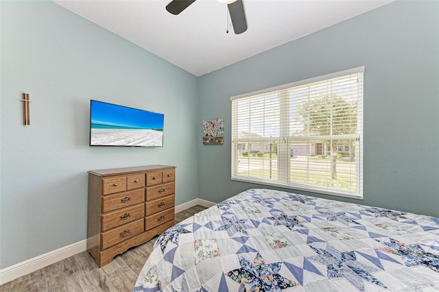 bedroom featuring light hardwood / wood-style floors and ceiling fan