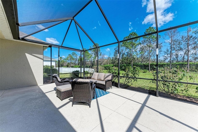 view of patio / terrace with an outdoor hangout area and glass enclosure