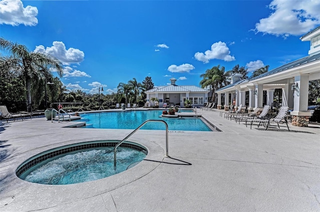 view of pool featuring a patio and a community hot tub