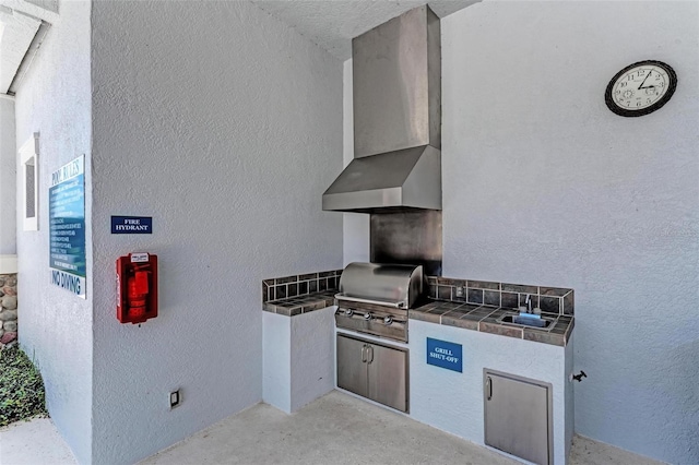 view of patio / terrace featuring sink, exterior kitchen, and grilling area