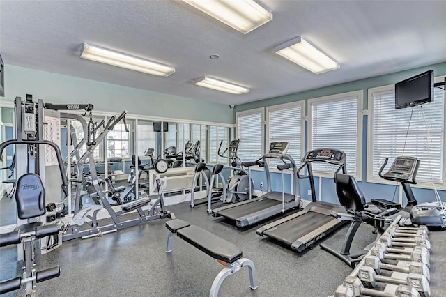 workout area with a textured ceiling