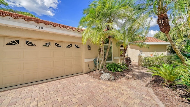 mediterranean / spanish-style house featuring a garage